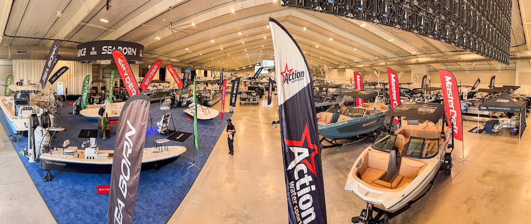panned out view of the 2026 ocala boat show featuring fx marine center with a carpeted boat display